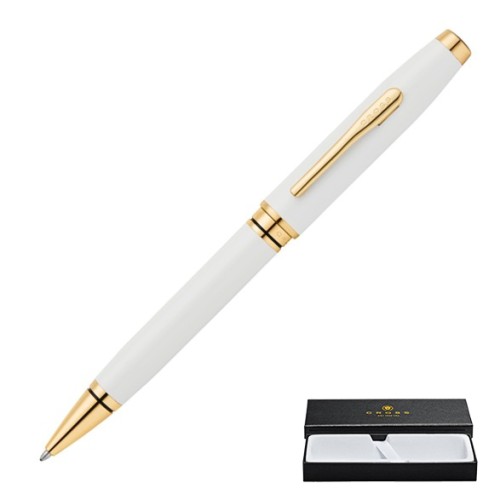 Perłowo-biały długopis Cross Coventry GT ze złotą skuwką i klipem obok firmowego pudełka prezentowego.