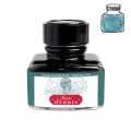 Szklany flakon 30 ml atramentu Jacques Herbin Fontaine des Quatre-Parties du Monde z czarną zakrętką i próbką koloru.