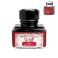 Szklany flakon 30 ml atramentu Jacques Herbin Bistro Parisien z czarną zakrętką i próbką koloru.