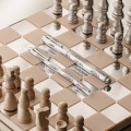 Zestaw luksusowych instrumentów piśmiennych Caran d'Ache Ecridor Damier na lustrzanej szachownicy z figurami szachowymi.
